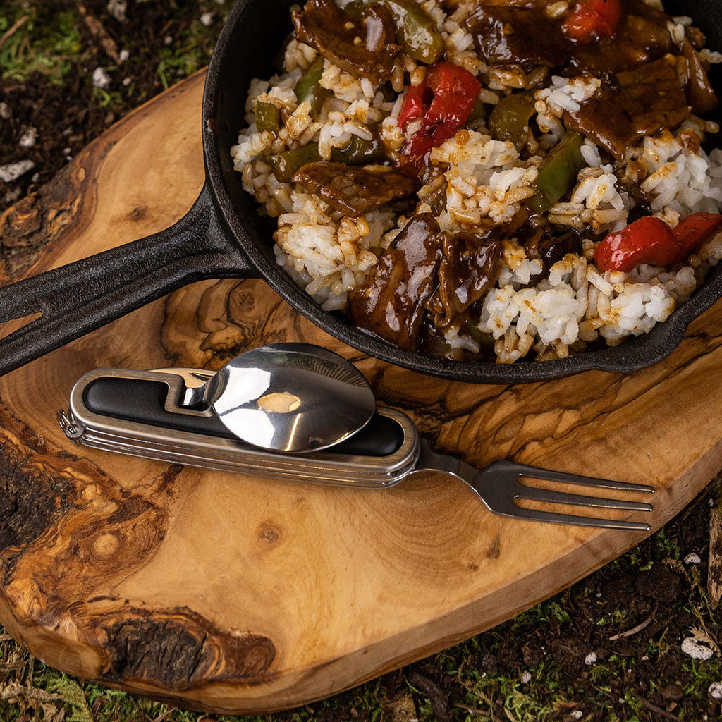 Eating from a pan outdoors