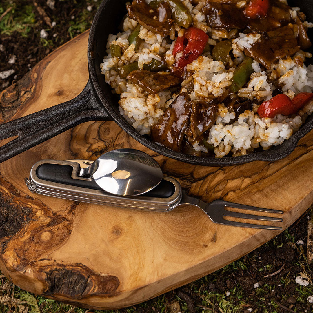 Eating from a pan outdoors